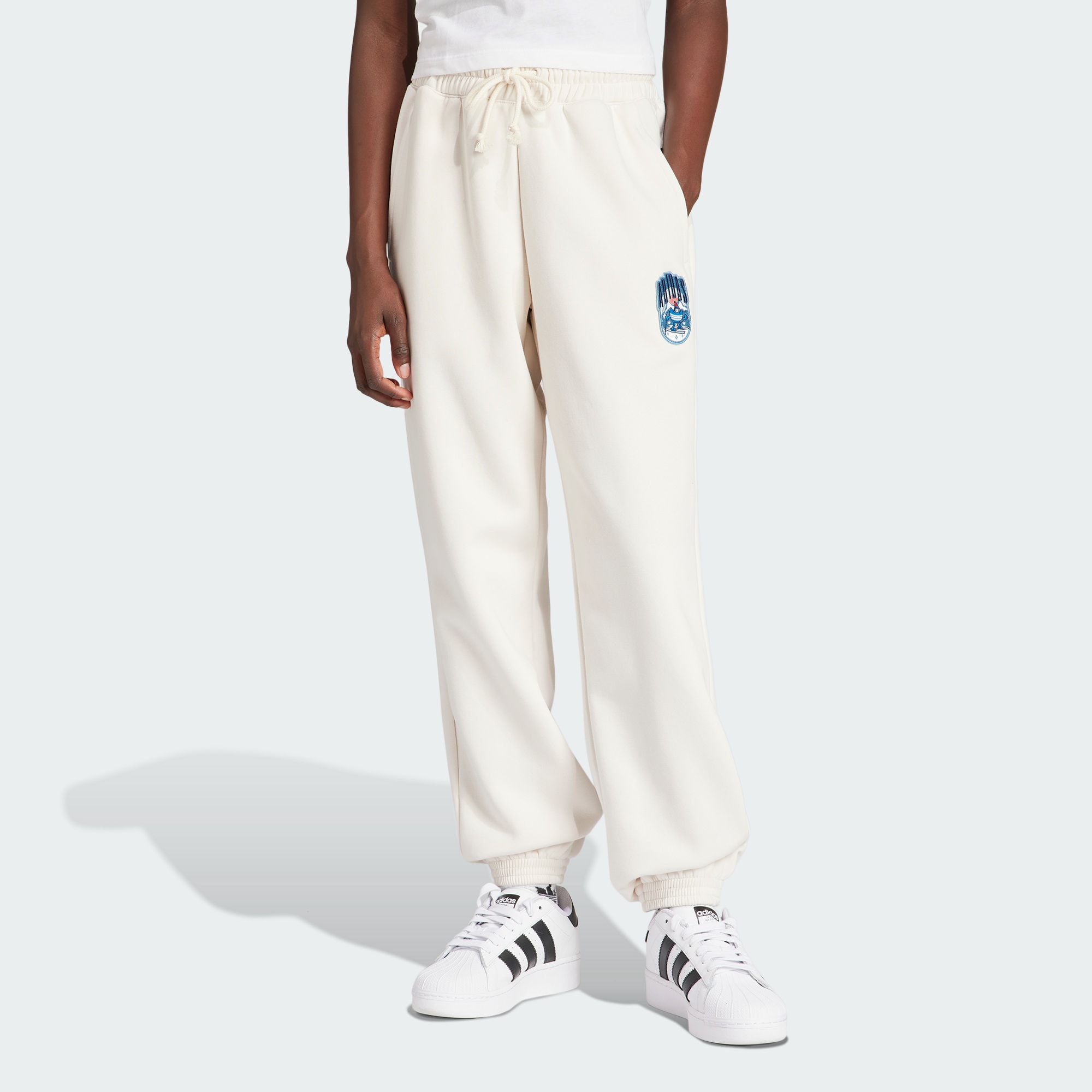 Женские брюки adidas HOLIDAY SWEAT PANTS розовые