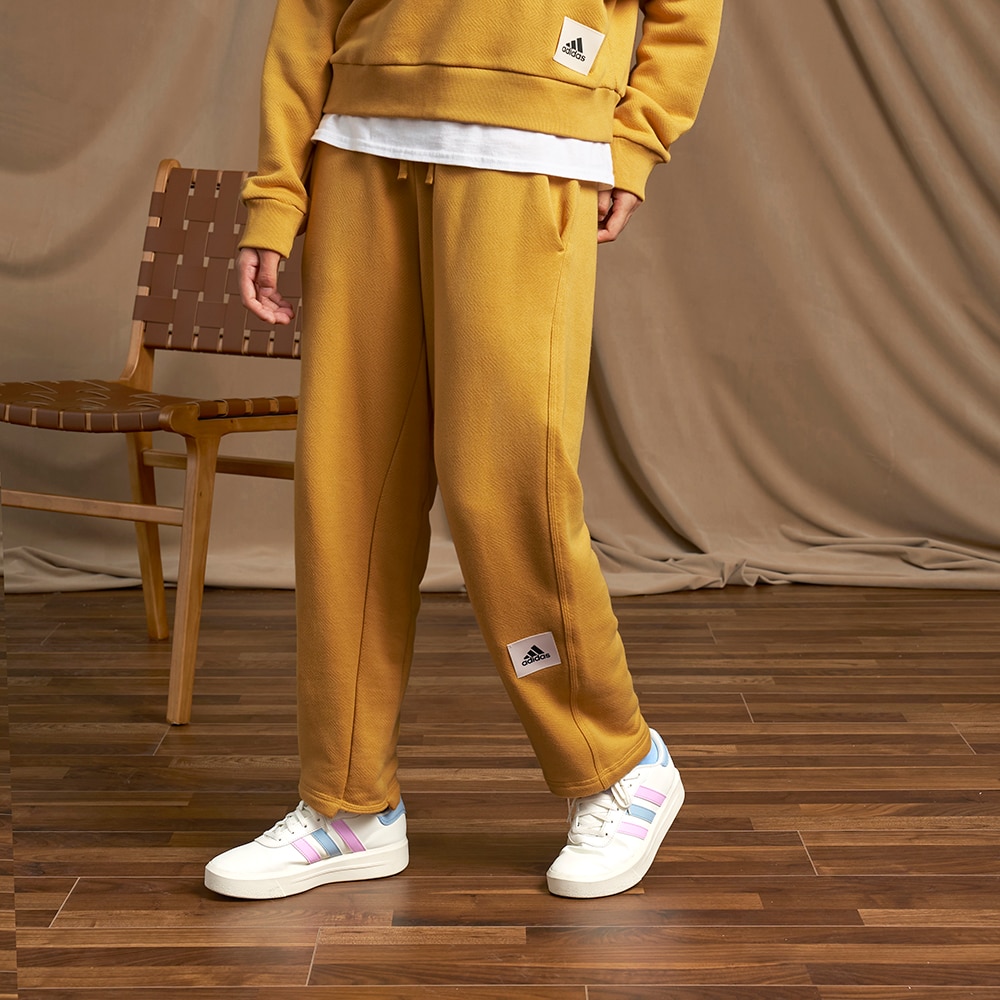 Adidas pants with store logo on leg