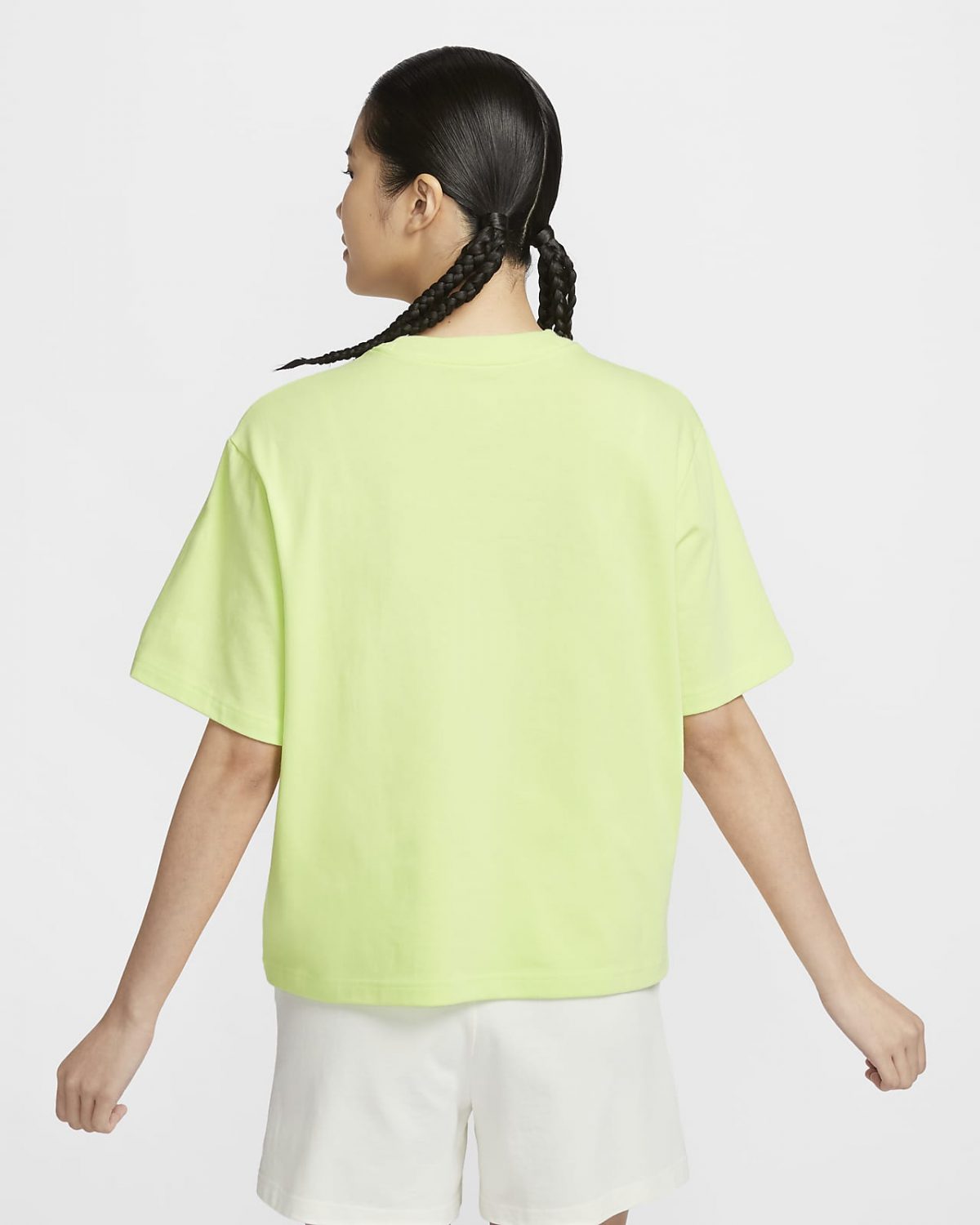 Женская футболка Nike Sportswear желтая фотография